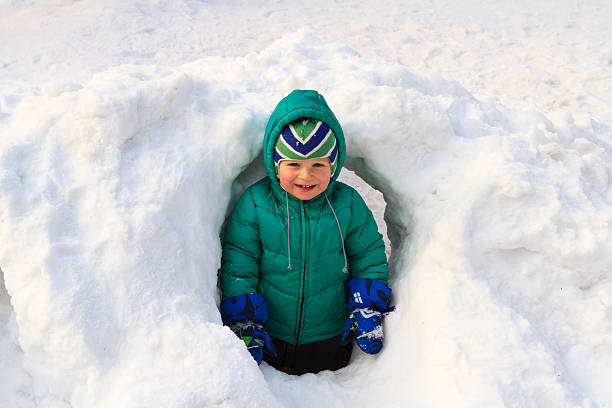 istock baby having fun in winter snow 177795401