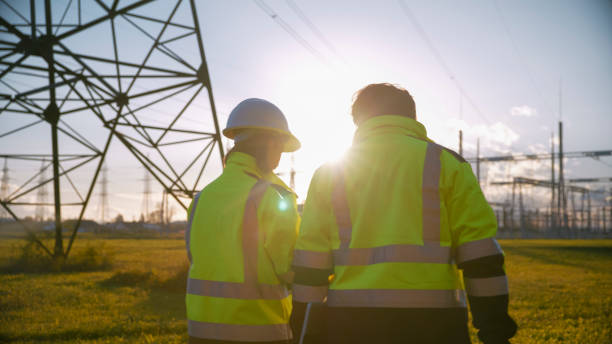 istock Sunlight Streaming Through Electrical Engineers Standing At Power Station During Sunny Day 1777961232
