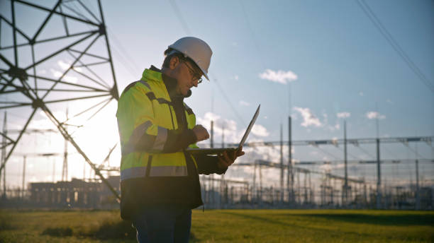 istock Side View Of Male Dedicated Electrical Engineer Working On Laptop At Power Station During Sunny Day 1777961794