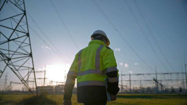 istock Electrical Engineer In Reflective Clothing Holding Laptop While Walking At Power Station During Sunset 1777961856