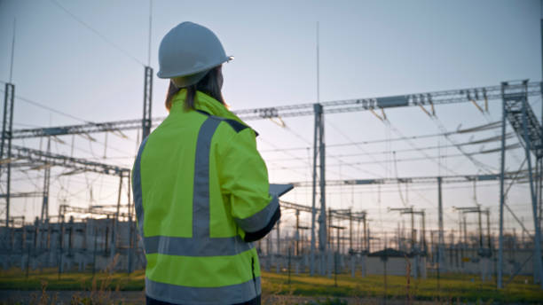 istock Rear View Of Ambitious Female Electrical Engineer Looking At Transformers On Power Station During Sunset 1777961933