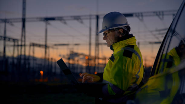 istock Dedicated Male Engineer Using Laptop While Leaning On Car At Dark Power Station During Twilight 1777965474