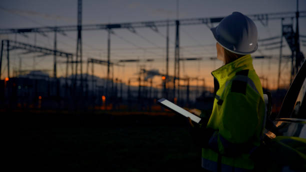 istock Thoughtful Female Electrical Engineer Looking Away While Holding Smart Phone At Dark Power Station During Twilight 1777965991