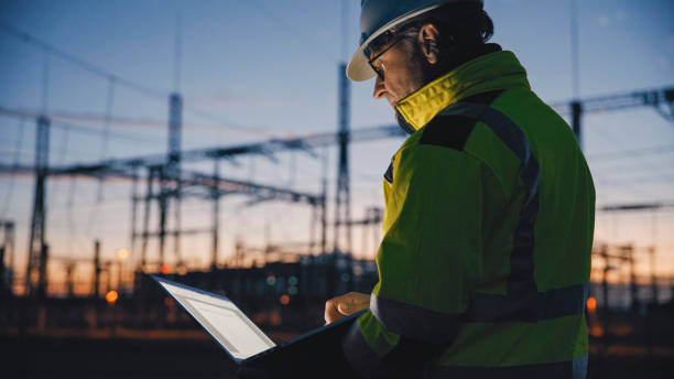 istock Side View Of Male Electrical Engineer Using Laptop At Dark Power Station During Twilight 1777965992