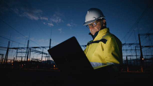 istock Dedicated Male Electrical Engineer Working On Laptop At Dark Power Station During Twilight 1777966551