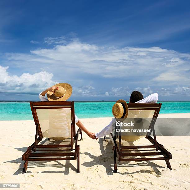 Couple On A Beach Stock Photo - Download Image Now - Maldives, Adult, Adults Only