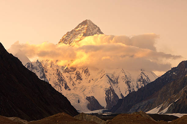 K2 in Pakistan at Sunset Sunset at K2, the second highest peak in the world, Karakorum Mountains, Pakistan k2 mountain panorama stock pictures, royalty-free photos & images