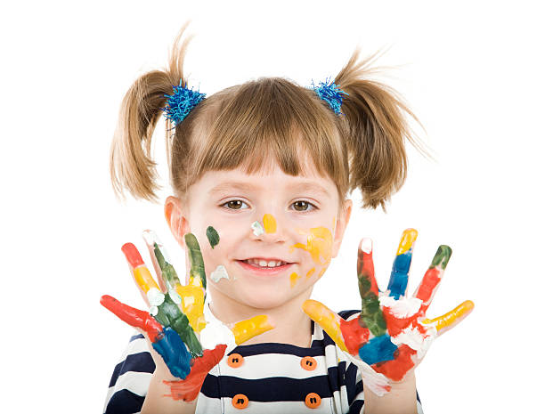 istock girl with hands soiled in a paint. 177797707