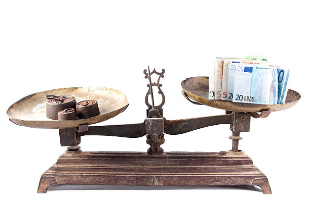 istock Old weighing scale with euro bills isolated 177797898