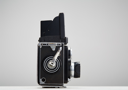 old vintage camera on white background film photography hipster style