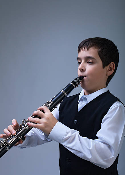 istock Boy playing on the clarinet 177798380