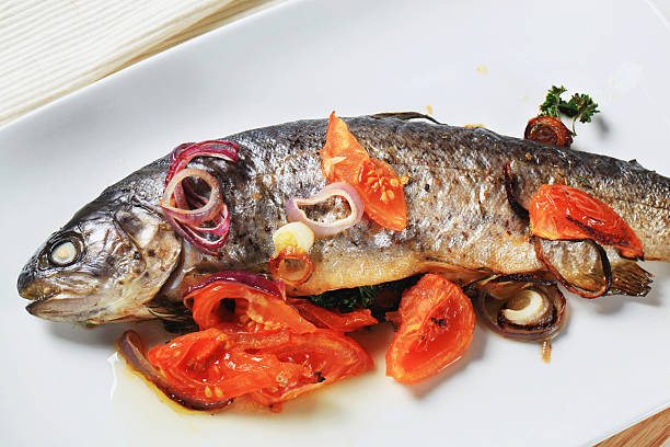 istock Baked trout with tomatoes and onion 177798700