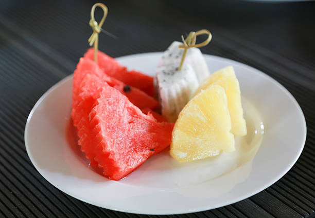istock Watermelon and pineapple on a white plate 177799469