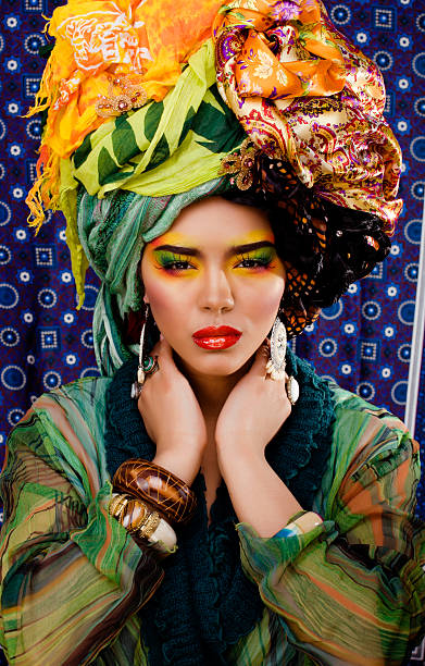 istock woman with creative make up, many shawls on head 177799746