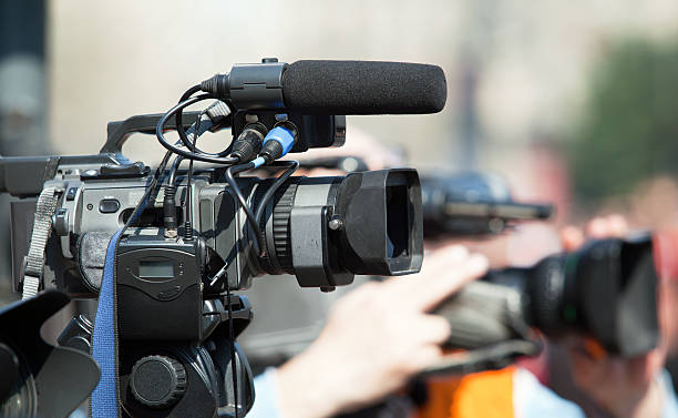 istock Covering an event with a video camera 177800194