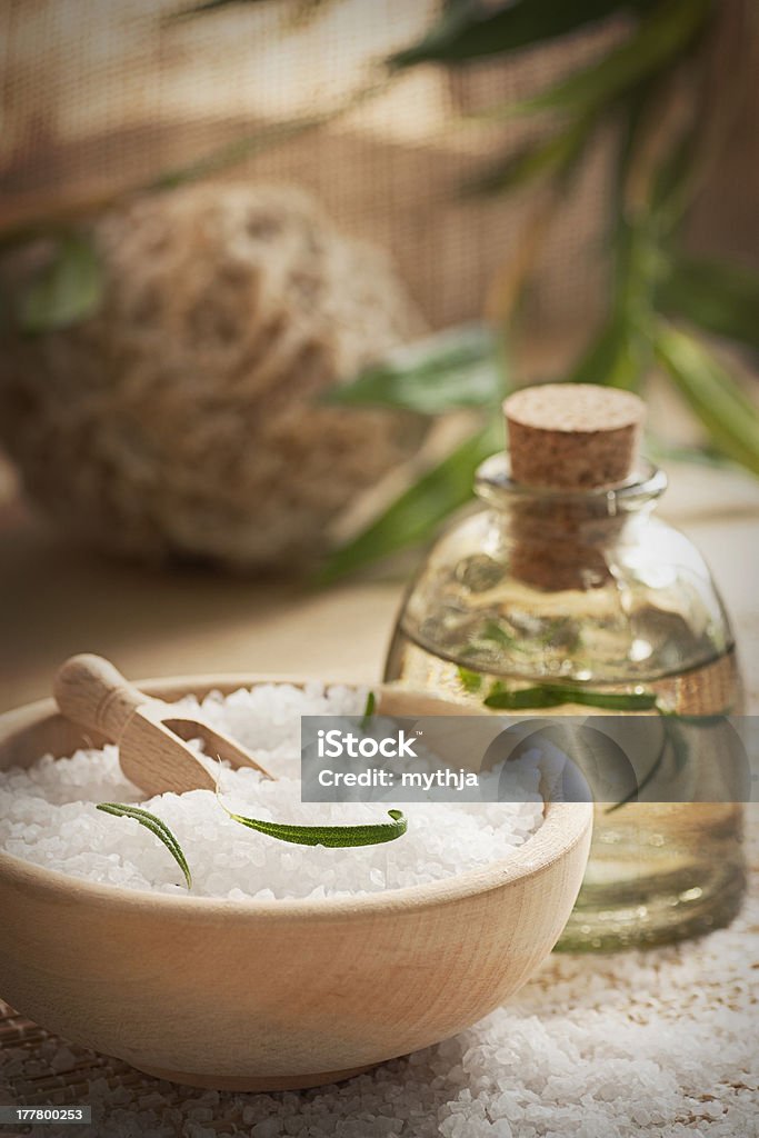 Spa setting with bath salt and soap Spa wellness setting with rosemary  and  natural remedies. Alternative Therapy Stock Photo