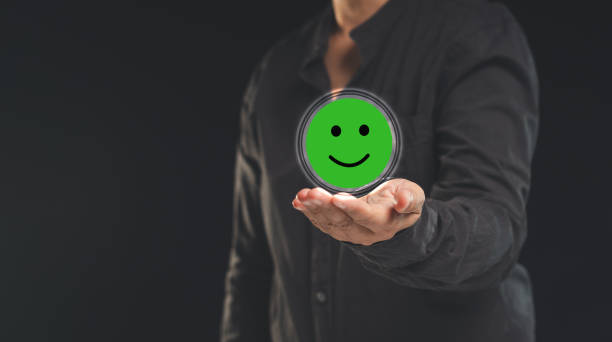 istock Happy mood icon in hand while standing on a black background 1778003725
