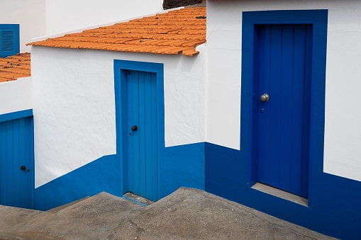 A blue and white building close to the Doca do Cavacas Natural Pools, Funchal ,Madeira