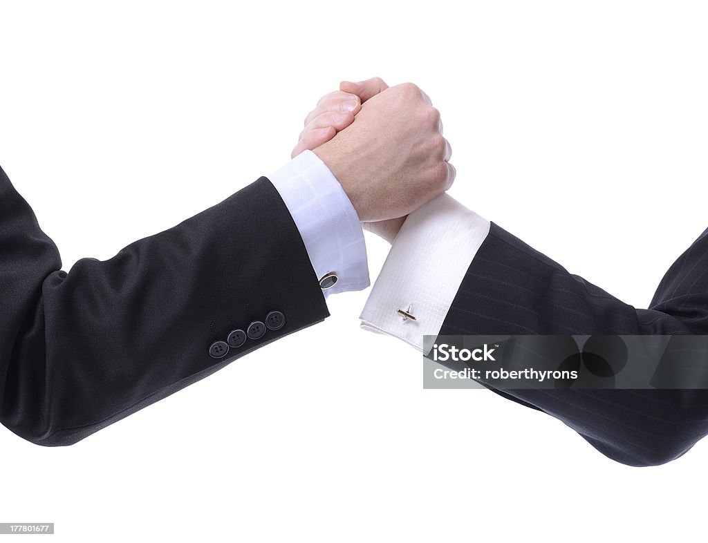 Arm Wrestling business two businessmen arm wrestling isolated on white Adult Stock Photo