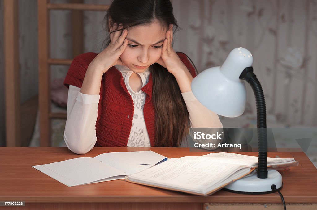girl was very tired to do homework the girl was very tired to do homework Beautiful People Stock Photo