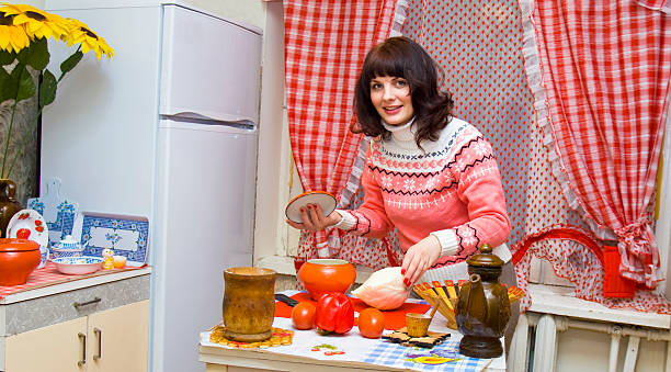 istock Woman in kitchen cooking 177802368