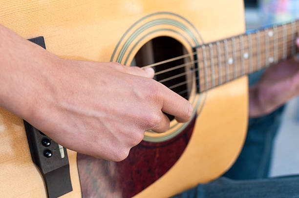 istock Teenage Boy playing Acoustic Guitar 177802402