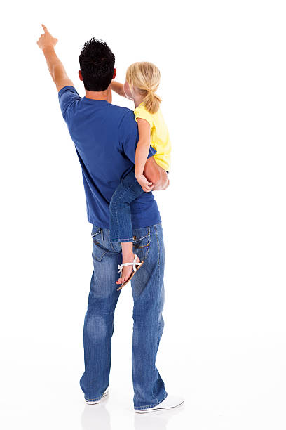 giovane padre e figlia che punta - rear view family isolated child foto e immagini stock