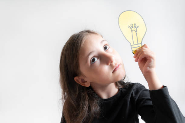 istock Girl Holding Light Bulb On Head 1778034144