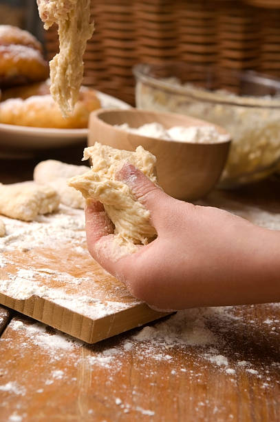 istock Detail of hands kneading dough 177803511