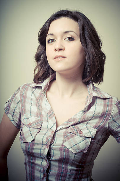 istock young woman with blouse posing 177803548