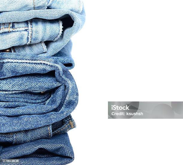 Stack Of Blue Jeans Stock Photo - Download Image Now - At The Edge Of, Blue, Casual Clothing