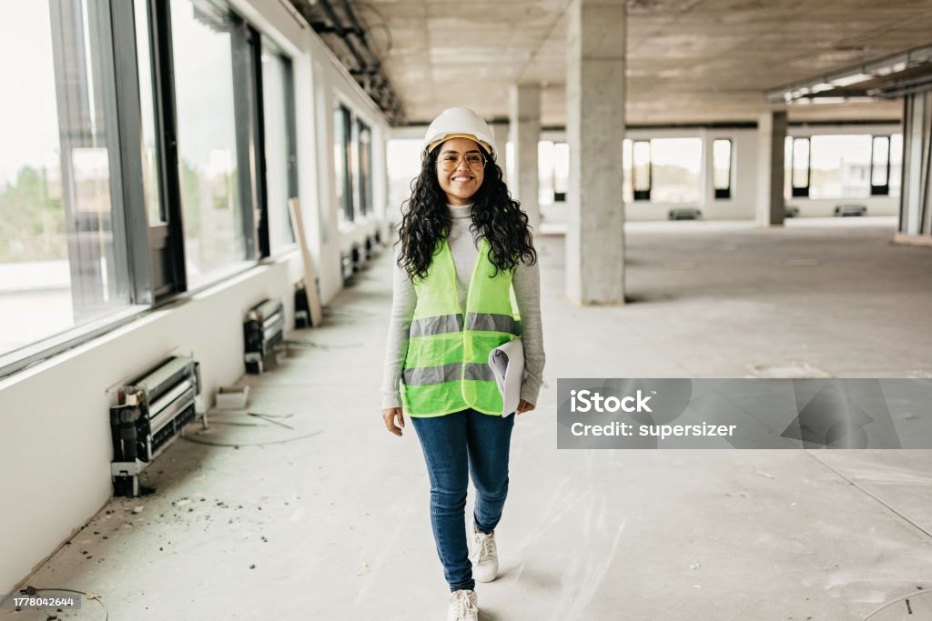 I love what I do Young female Indian engineer on the construction site - inspecting Portrait Stock Photo