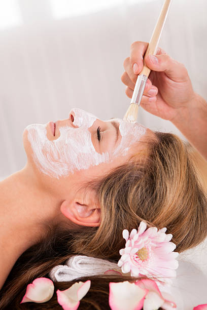 istock Beautician applying a face mask 177804759