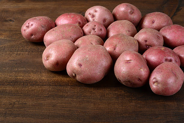 istock New red potatoes on wood 177804897