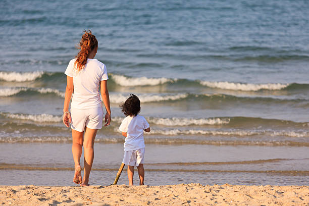 istock Asian mom and son on beach 177805025