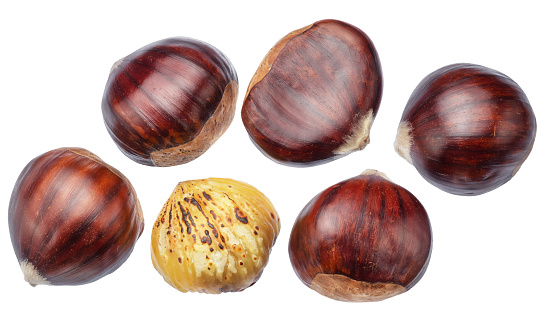 Edible sweet chestnuts with roasted chestnuts isolated on white background. Clippingh path. Great food background for your projects.