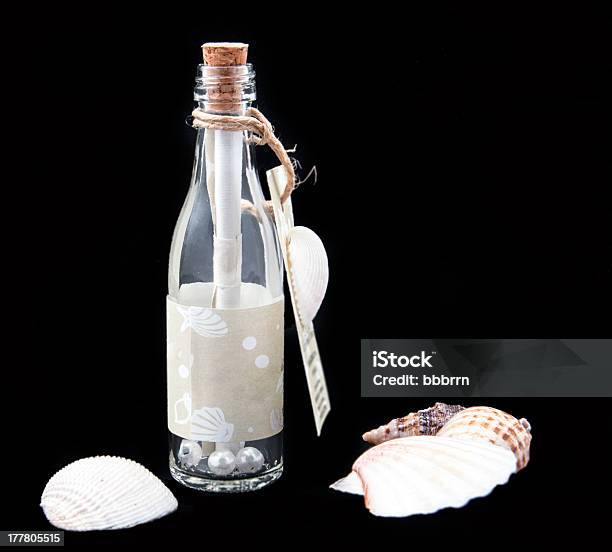 Message In A Bottle Stock Photo - Download Image Now - Animal Shell, Black Color, Bottle