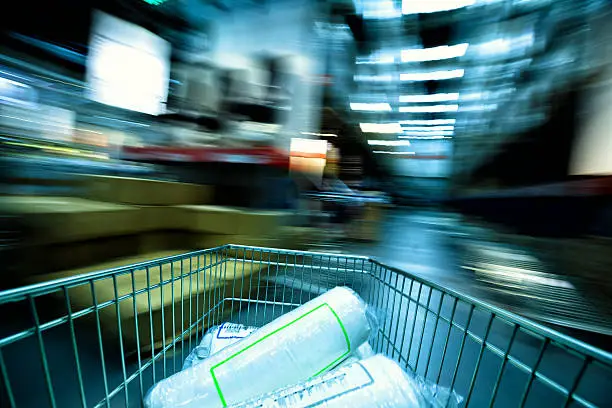 Motion-blurred of a moving shopping cart, shot with a slow shutter.
