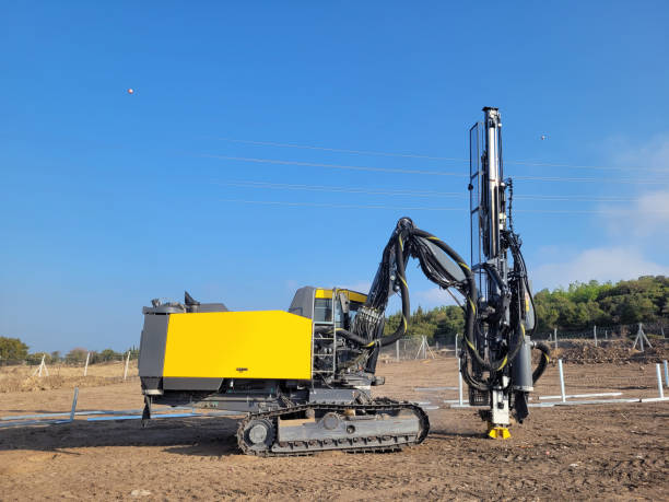 work machine drilling holes in the ground