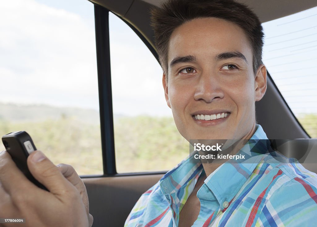 Young male on smartphone young male on smartphone getting good news. 20-29 Years Stock Photo