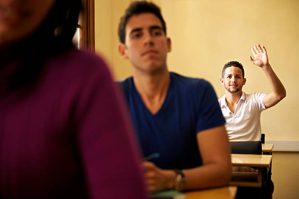 istock People and education, student asking question to teacher in univ 177806197