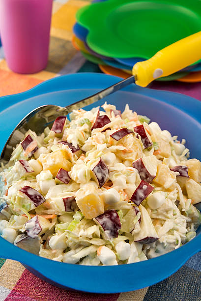 istock Bowl of coleslaw with apples, marshmallows and pineapple 177806230