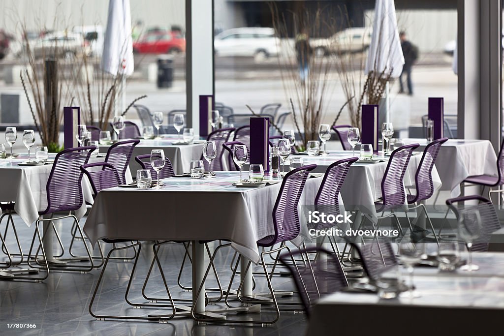 Indoor restaurant tables ready for service Indoor restaurant tables ready for service. Small GRIP shot Arranging Stock Photo
