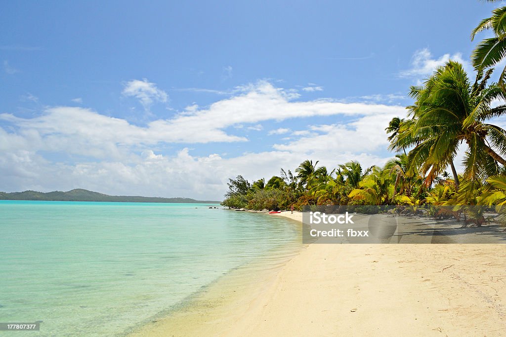 Idyllic beach for relaxing The gorgeous turquoise sea and desert beach in Ee Island. Woman walking on the beach. Desert Island Stock Photo