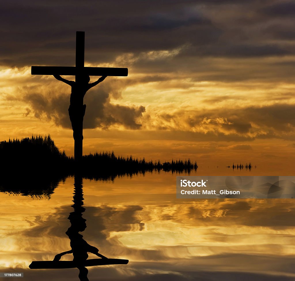 Jesus Christ Crucifixion silhouette reflected in lake water Silhouette of Jesus Christ crucifixion on cross on Good Friday Easter reflected in lake water Allegory Painting Stock Photo