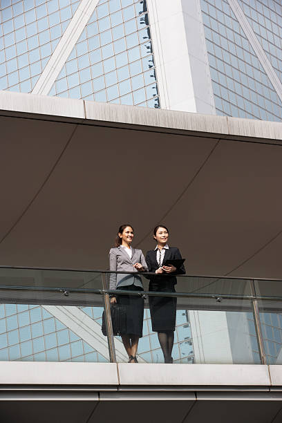 istock Two Businesswomen Having Discussion Outside Office Building 177807700