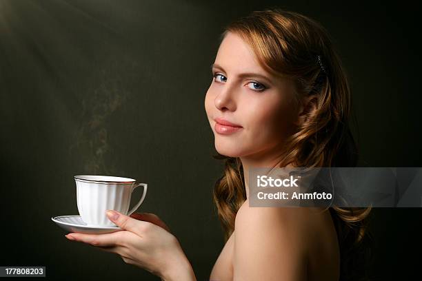 An Attractive Girl With A Cup Of Coffee Stock Photo - Download Image Now - Adult, Breakfast, Brown Hair