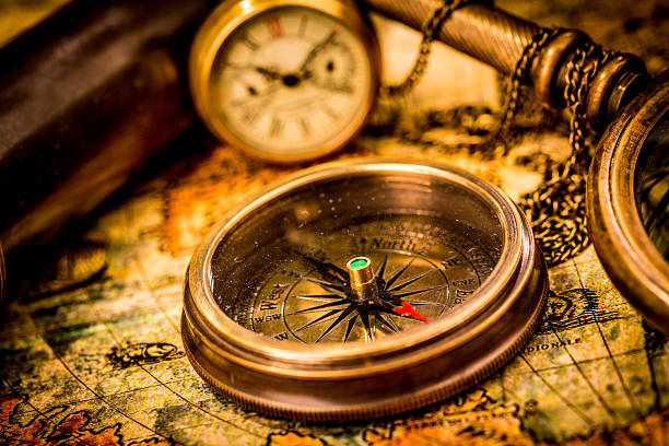 istock Vintage compass lies on an ancient world map. 177808758