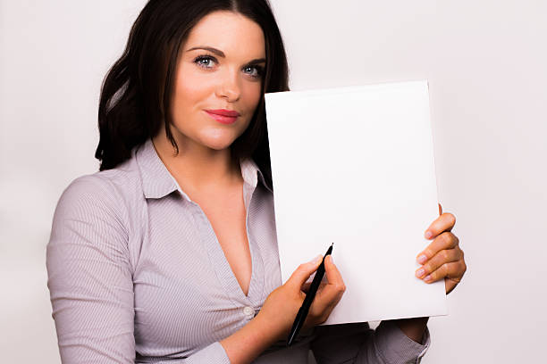 istock Business women taking notes on a pad with pen 177809908