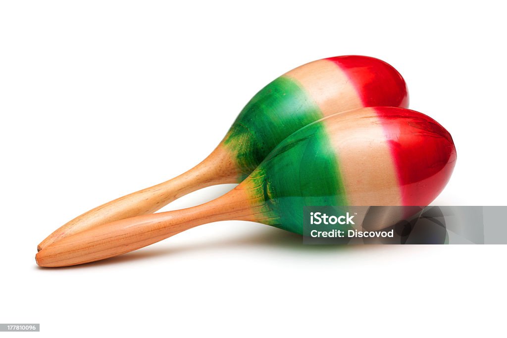 A closeup of red and green painted maracas from Mexico photo of maracas on white background Maraca Stock Photo